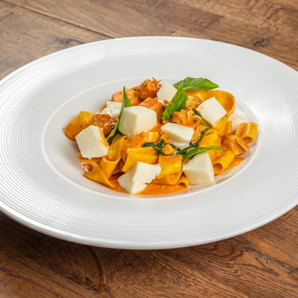 Tutto Pizza & Pasta's pappardelle pasta with creamy tomato sauce, fresh mozzarella, and basil.